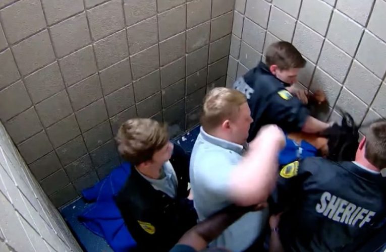 Newly Released Video Shows Corrections Officer Being Booked in Jail, What Allegation Imposed