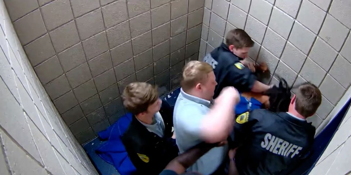 Newly Released Video Shows Corrections Officer Being Booked in Jail, What Allegation Imposed