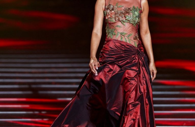 Halle Berry slips back into her sheer 2002 Oscars gown in fashion show and looks exactly the same 22 years later