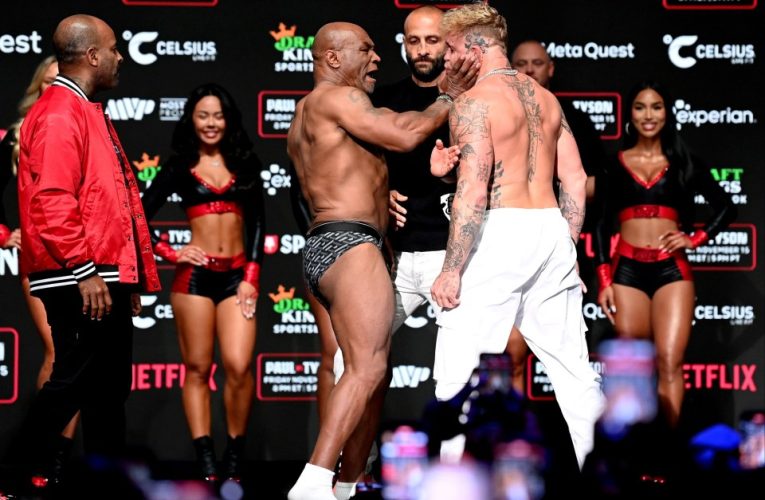 Mike Tyson SLAPS Jake Paul before being pulled apart by security in CHAOTIC weigh-in before controversial Netflix fight