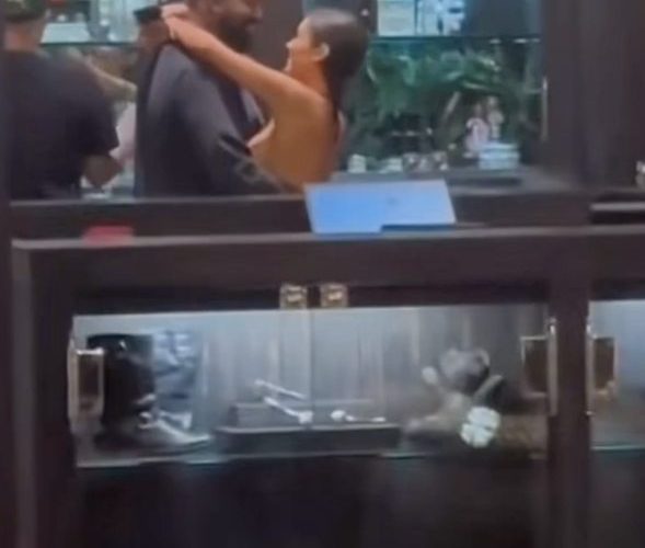 Bianca Censori goes nearly topless as she wraps her arms around smiling husband Kanye West at Tokyo shop