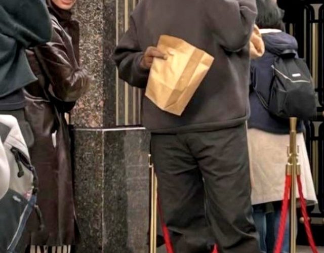 Bianca Censori rocks zebra boots and brown trenchcoat on day out with husband Kanye West in Tokyo