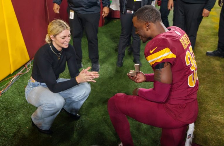 Washington Commanders star Jeremy Reaves melts hearts with proposal to fiancee Mikaela Worley on field after big NFL win