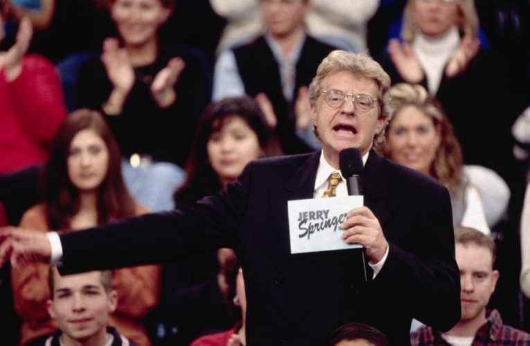 Who was Jerry Springer announcer Chuck Conners and when did he die?